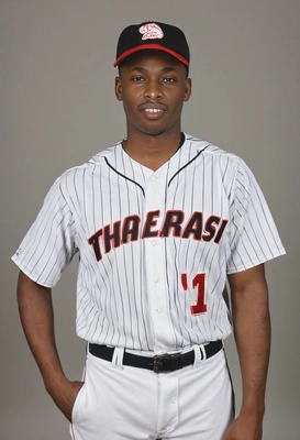 as a baseball pitcher, dressed in a professional baseball uniform