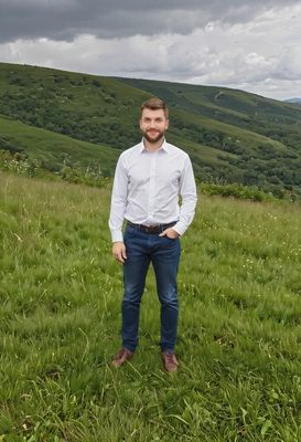 standing on a grassy hilltop