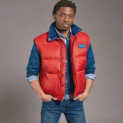 as Marty McFly from Back to the Future, wearing a red puffer vest and denim jacket, full body view