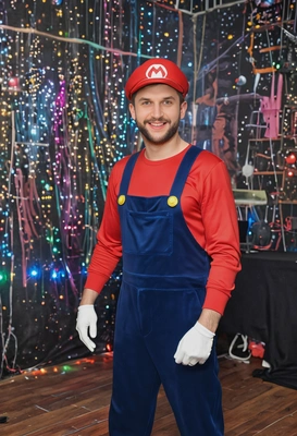 in a Mario costume at a party, background with disco lights