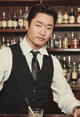 bartender shaking a cocktail, retro style, grainy