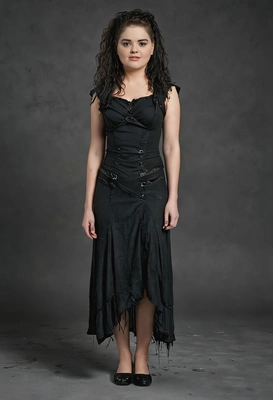 as Bellatrix Lestrange from Harry Potter, wearing a tattered black dress with dark, smudged makeup, standing in Azkaban, full body view 