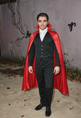 wearing a classic Dracula costume with a cape, Halloween party