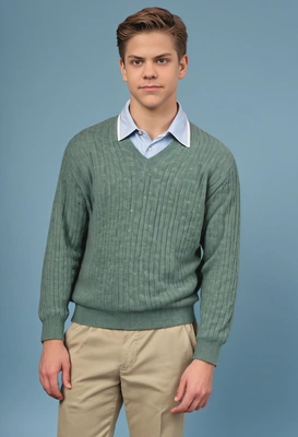 as an 80s prep student, wearing a pastel polo shirt with a popped collar, cable knit sweater tied around shoulders, khaki pants, and boat shoes, standing in front of a typical yearbook blue background