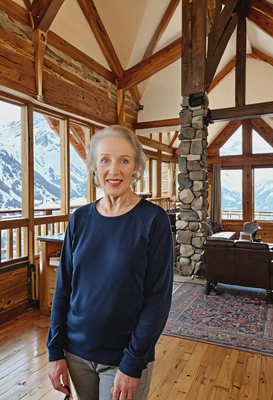 standing in a grand alpine lodge
