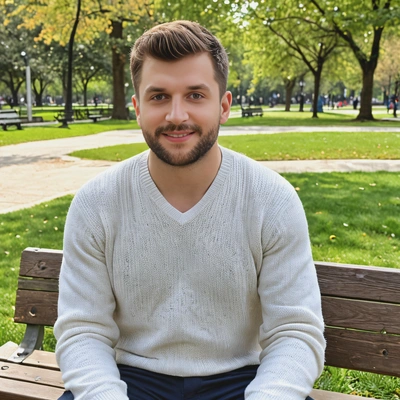 wearing a casual v-neck sweater, sitting on a park bench