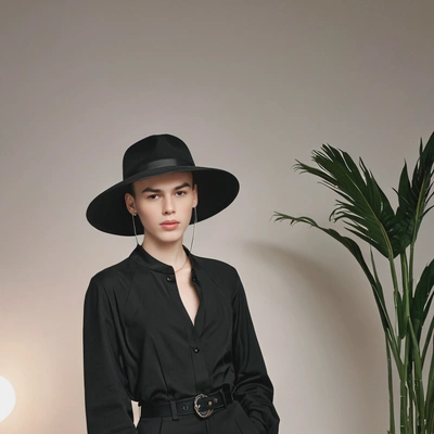 'chic all-black outfit in k-pop photoshoot set'
