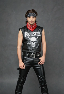 as an 80s glam metal fan, in leather pants and a bandana, with a heavy metal band tee, posing rockstar style, against a classic yearbook backdrop 